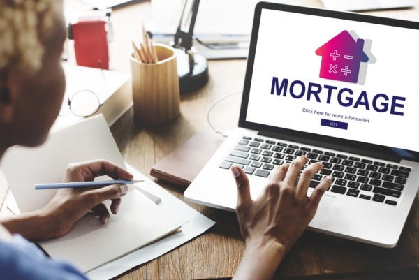 person researching mortgages on computer