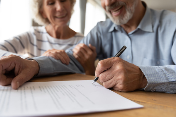 a man and a woman about to sign a Will