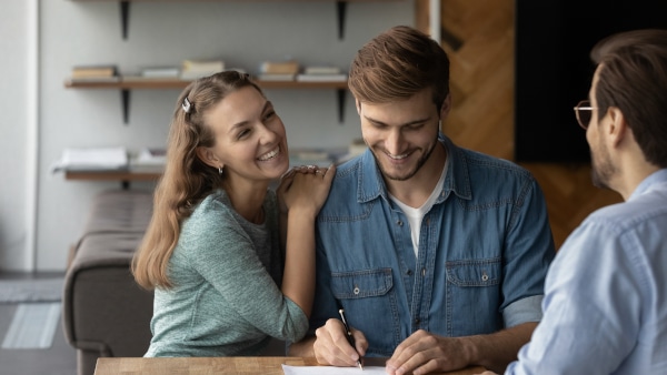 A solicitor explaining shared equity paperwork to first-time buyers