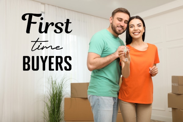 First-time buyers standing in their new home in Scotland after using the First Homes Fund.